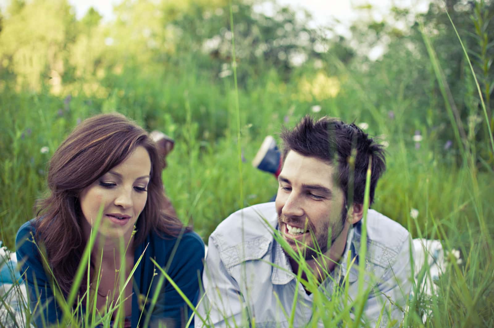 Canva - Man and Woman Lying on Grass Field