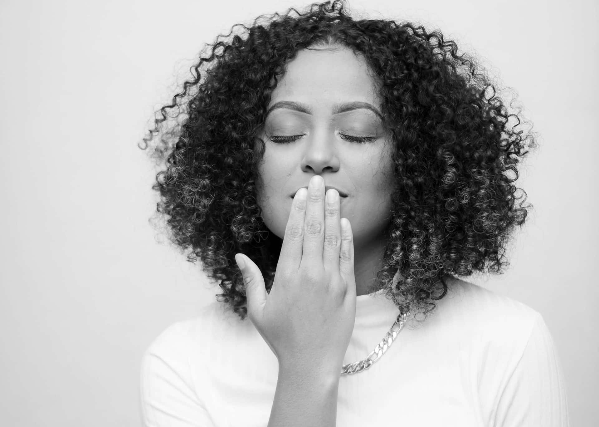 grayscale-photo-of-standing-woman-with-her-eyes-closed-2889527(1)