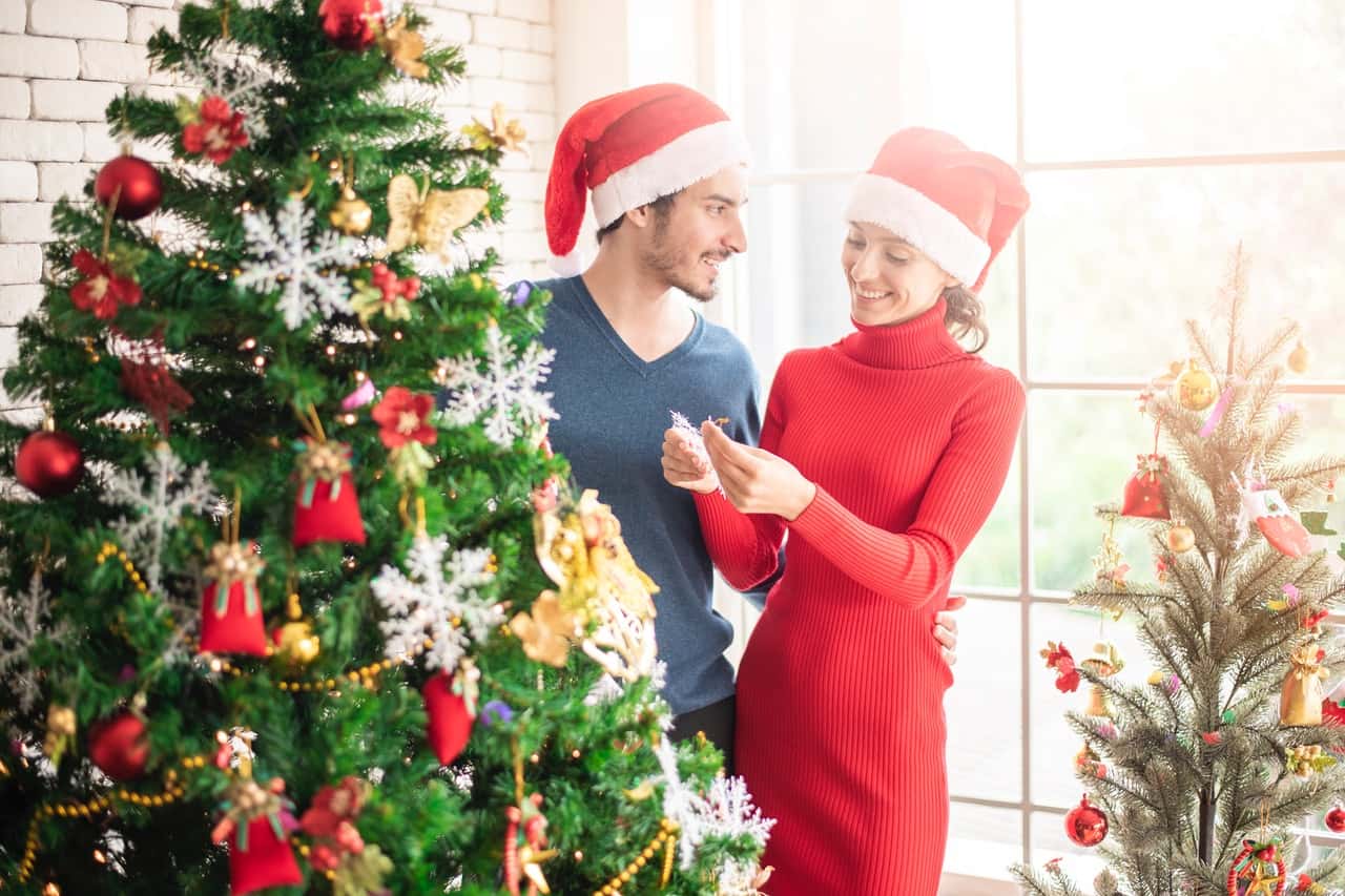 man-and-woman-standing-beside-christmas-tree-3183385