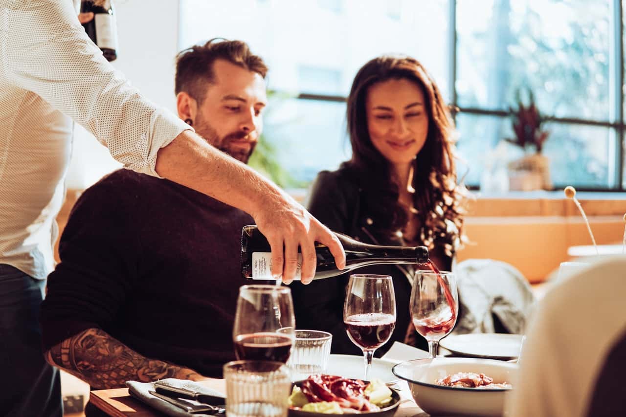 man-pouring-wine-on-glass-2647938