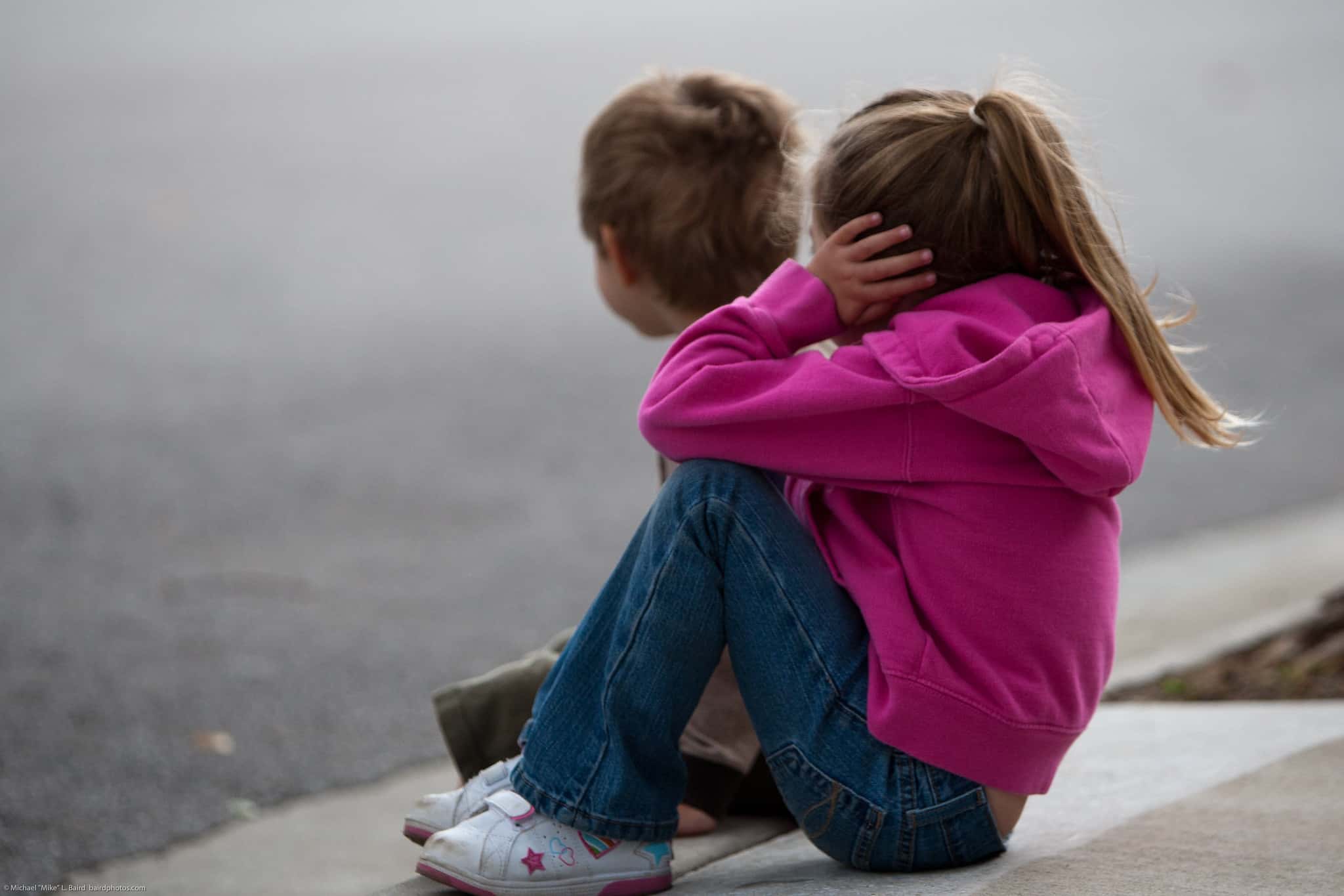 Two Kids Watch the Parade, Covering Ears from Noise from a Band