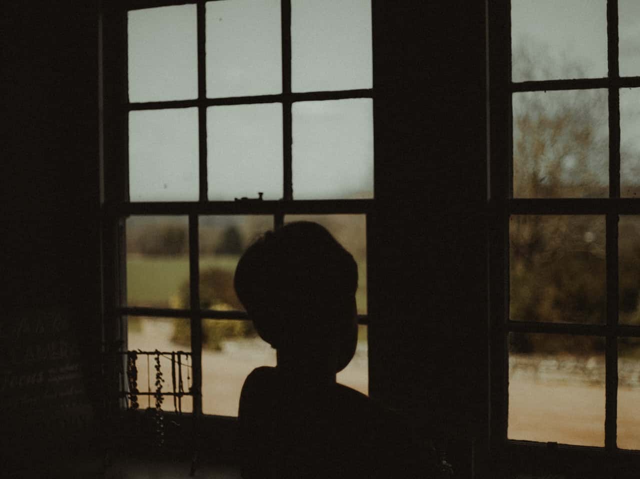 boy-standing-near-the-window-2262737