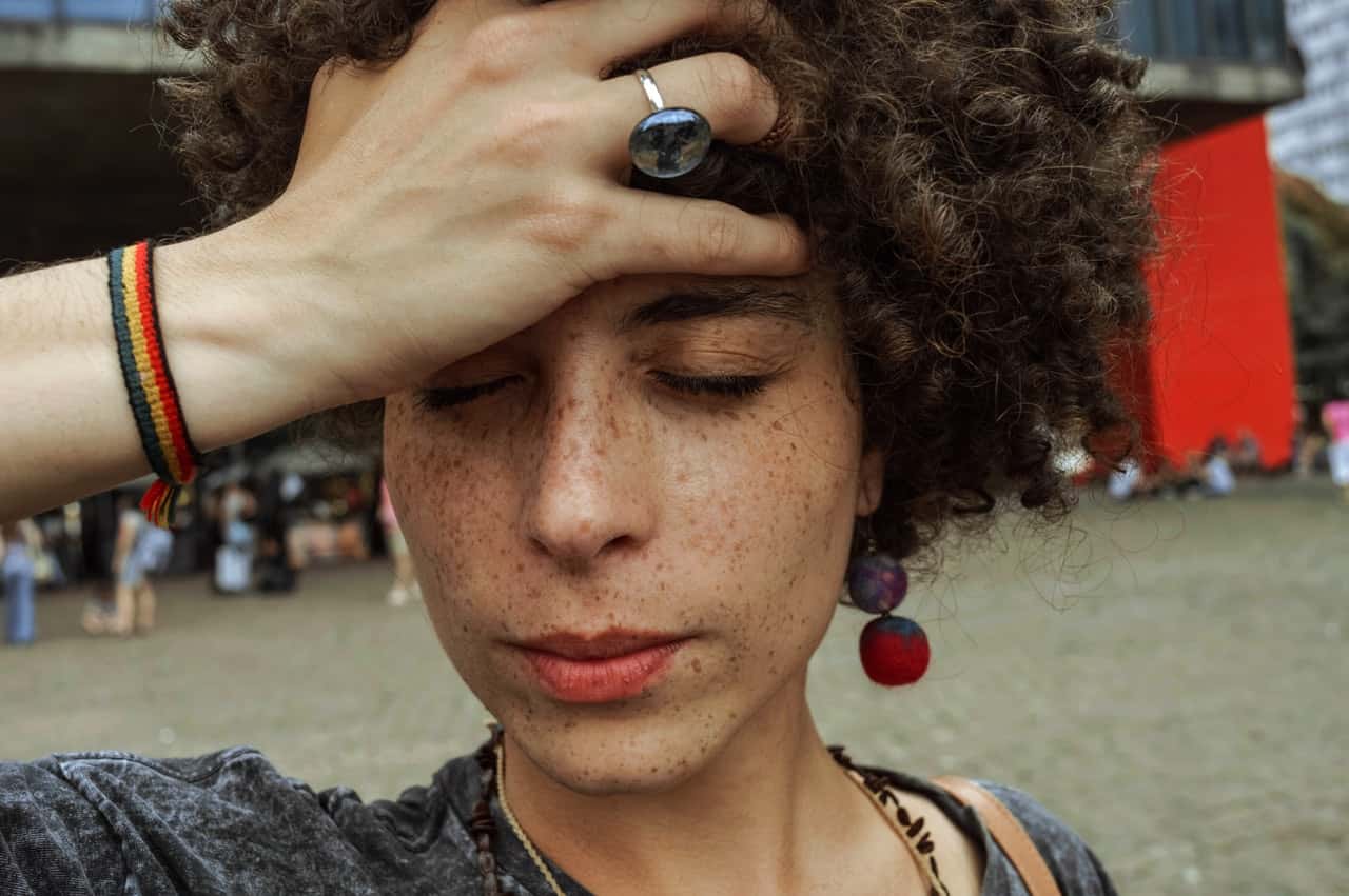 close-up-photo-of-woman-with-her-eyes-closed-holding-her-2023128