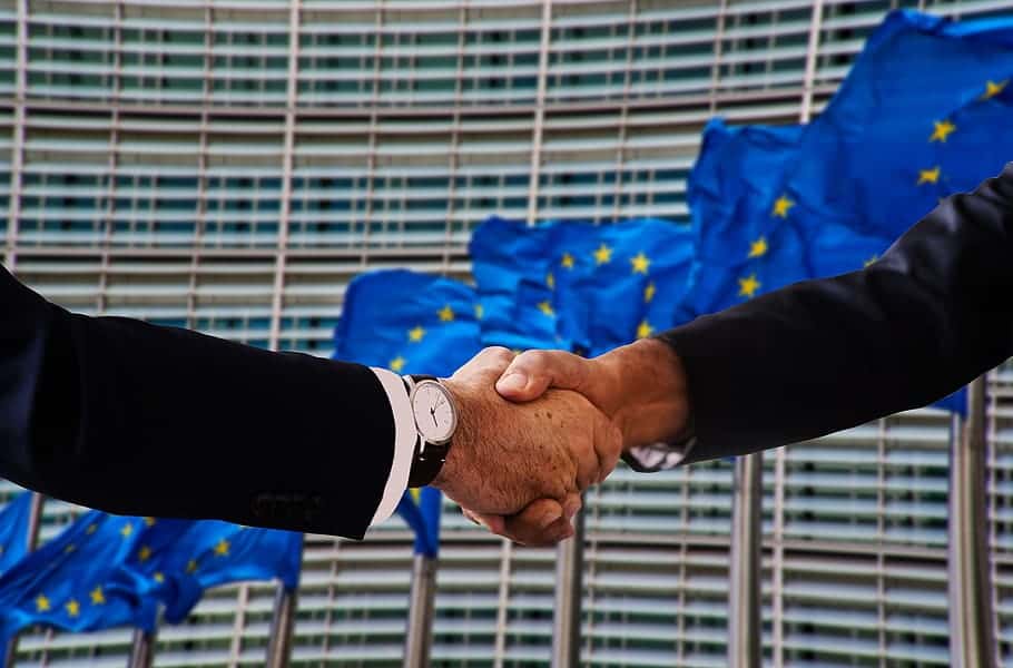 handshake-shaking-hands-europe-flag-policy-politician