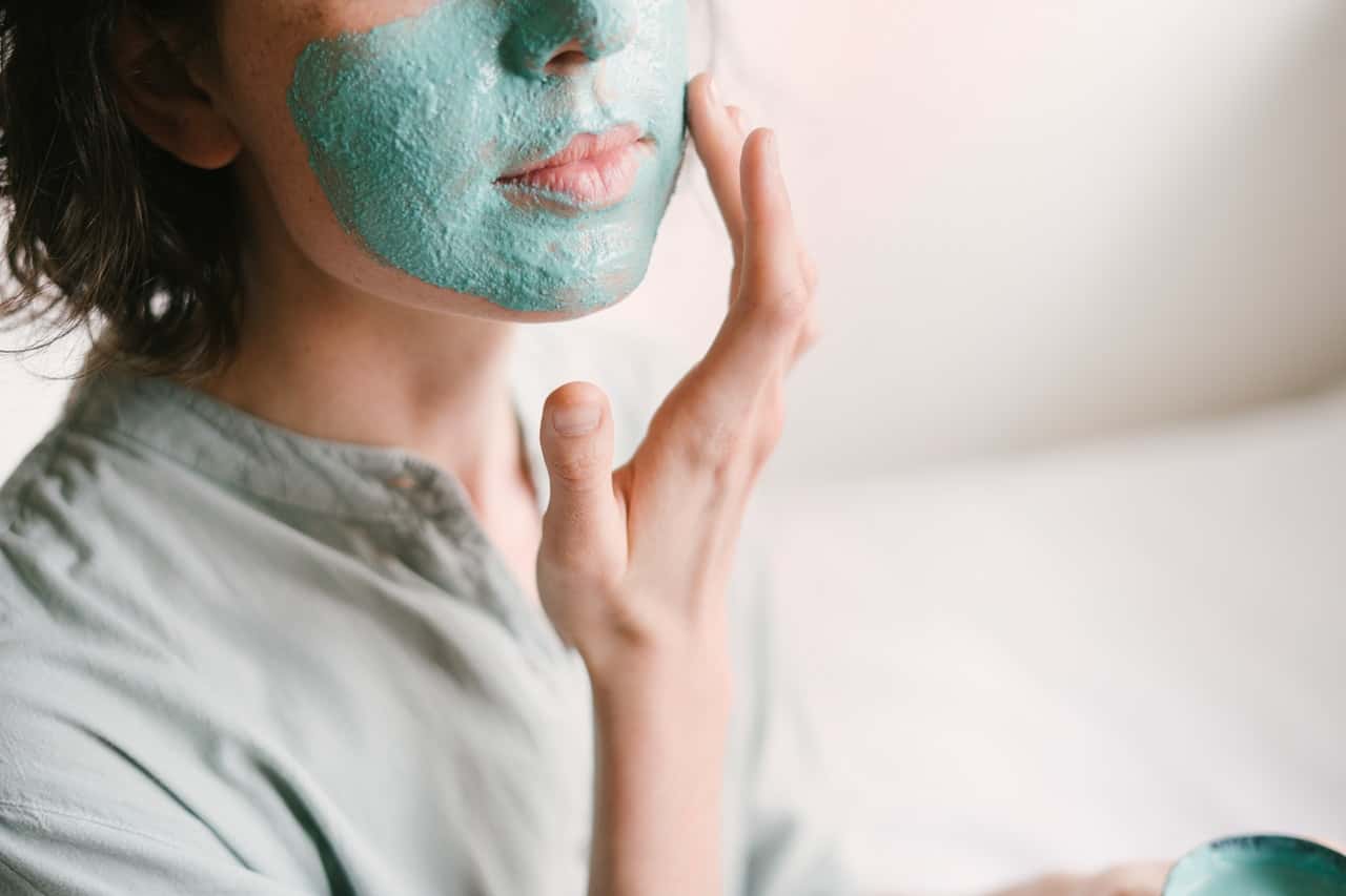 woman-putting-medicated-cream-on-her-face-3059404