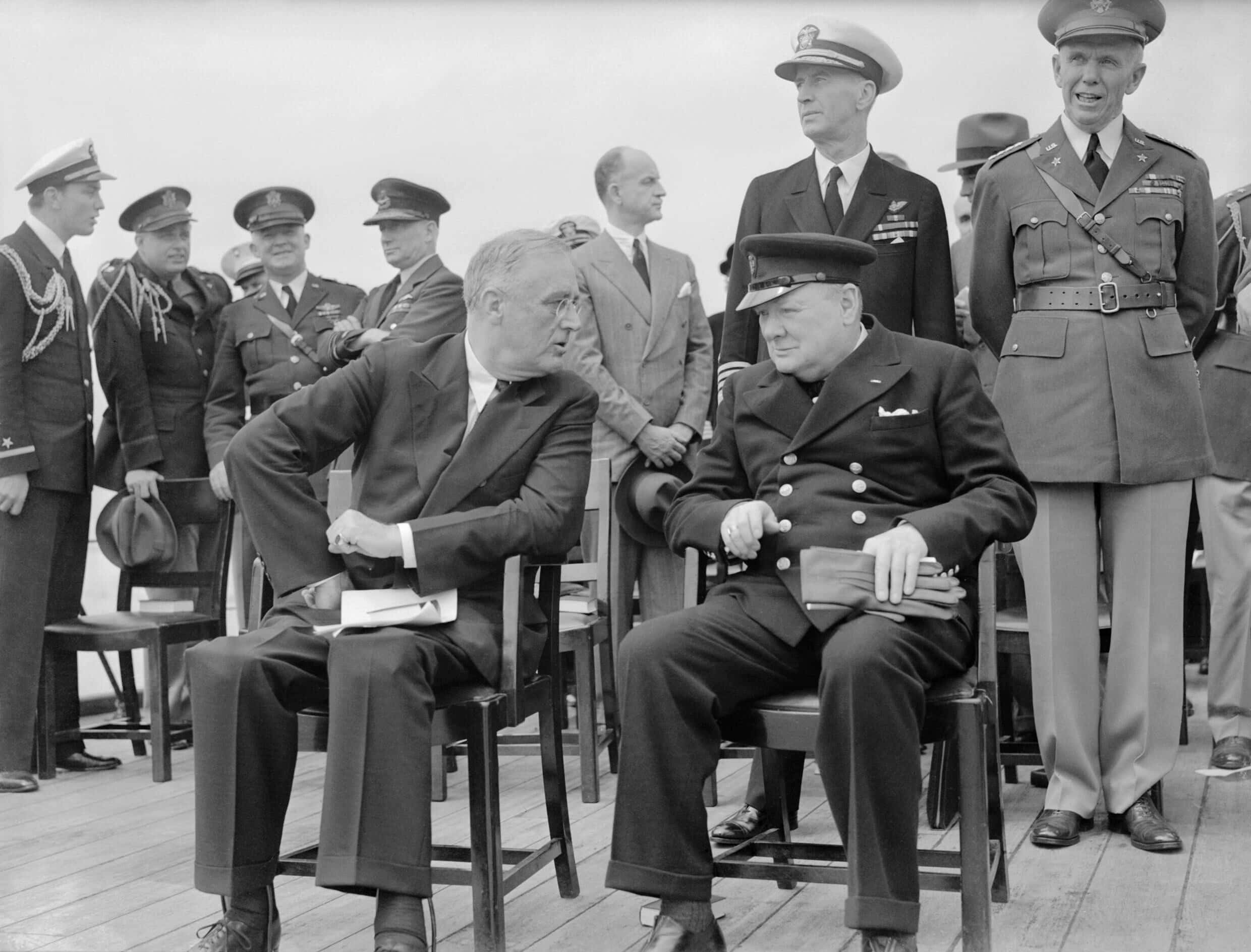 President_Roosevelt_and_Winston_Churchill_seated_on_the_quarterdeck_of_HMS_PRINCE_OF_WALES_for_a_Sunday_service_during_the_Atlantic_Conference,_10_August_1941._A4815