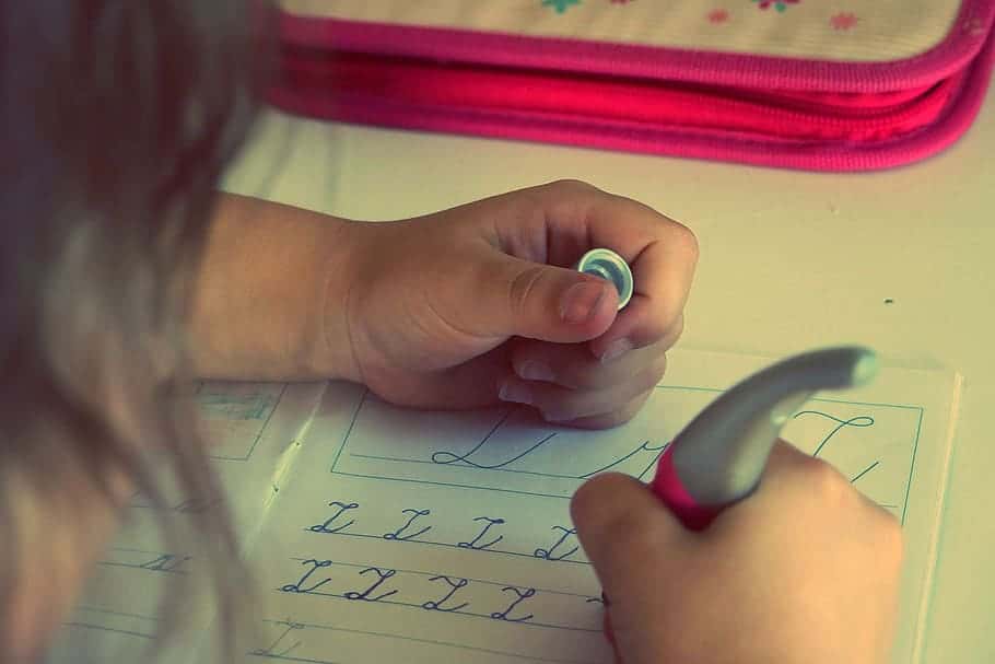 child-kid-writing-homework-letters-school