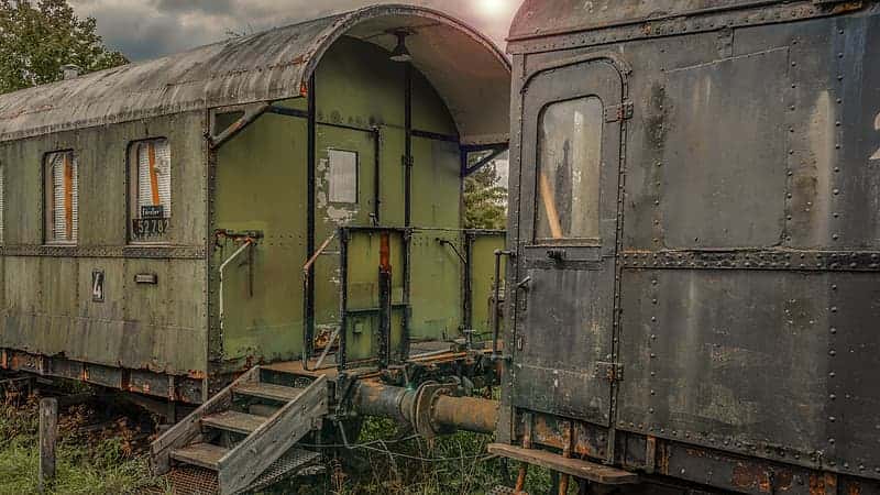 green-and-brown-train-during-daytime