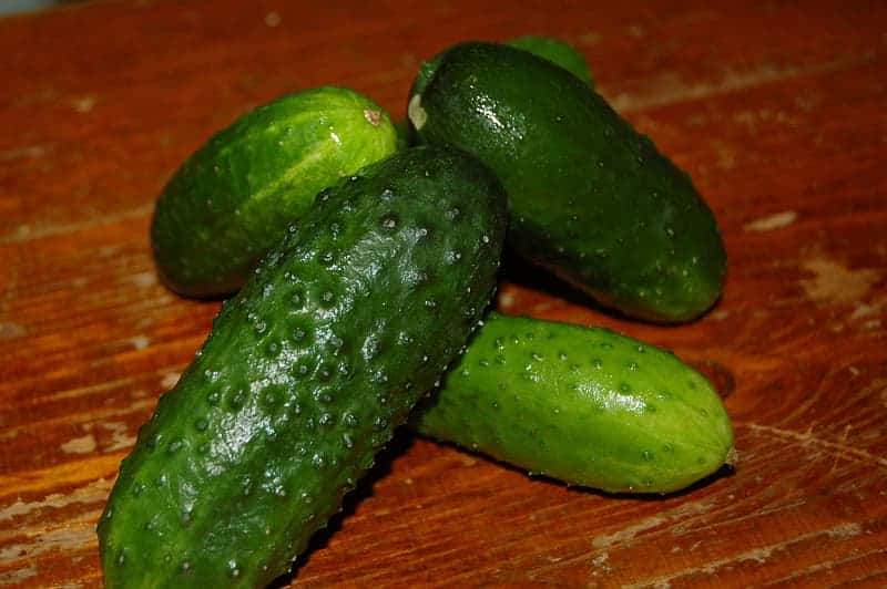 green-cucumber-on-brown-wooden-table