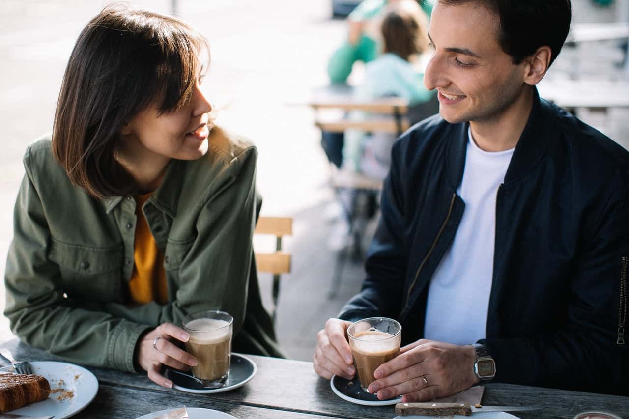 man-and-a-woman-having-coffee-while-chatting-3395280