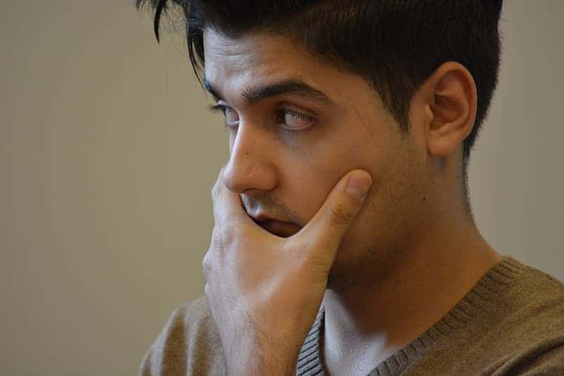 man-holding-his-face