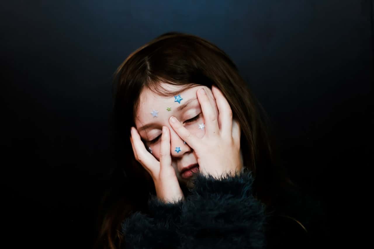 person-covering-face-with-hands-2723110