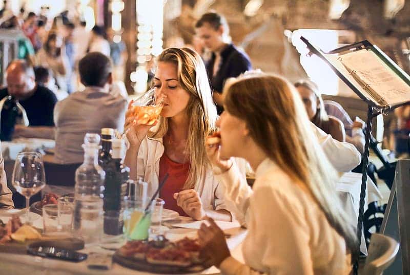 selective-focus-on-young-woman-drinking-wine-in-restaurant