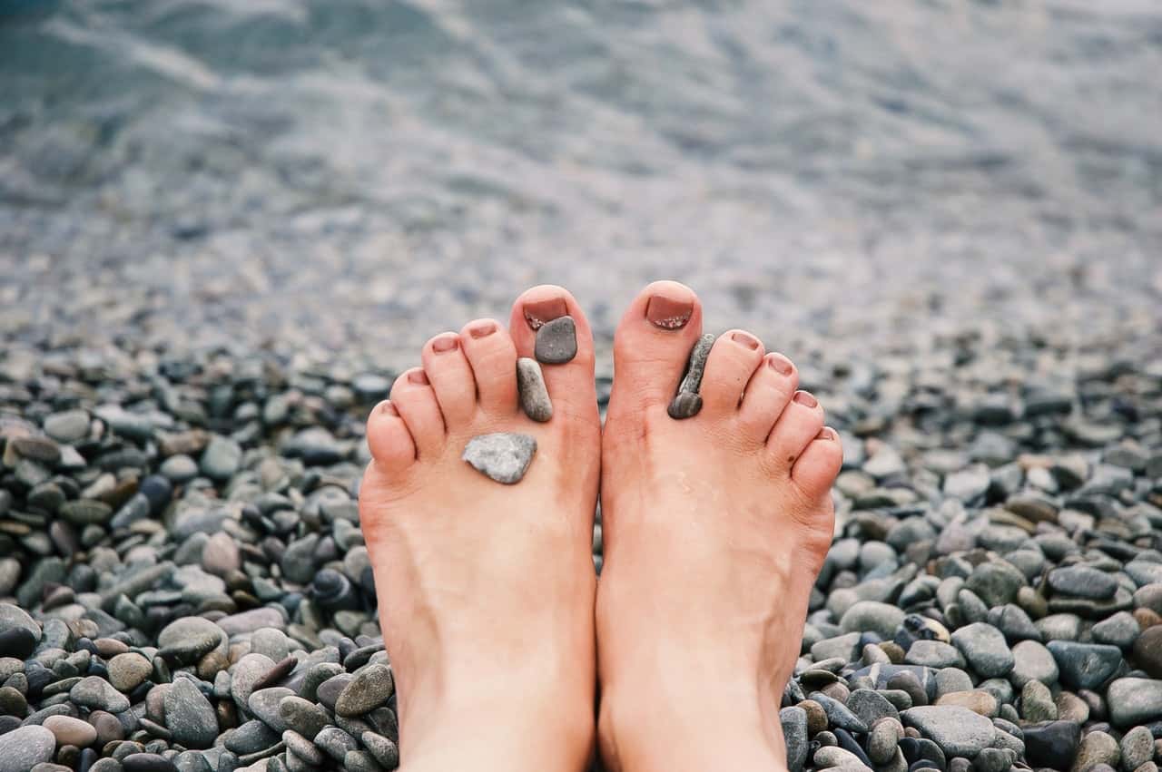 stones-on-woman-s-feet-1274061