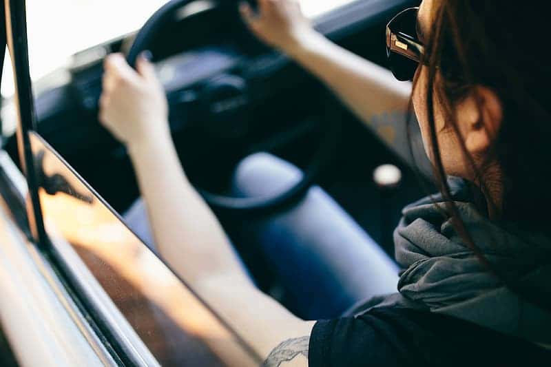 woman-in-black-jacket-driving-car