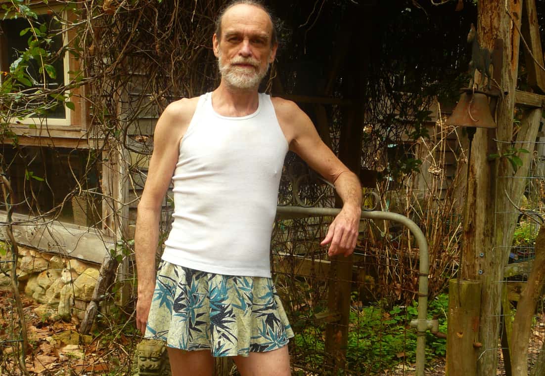 Man_In_Men's_Skirt._Sandals,_And_Tank_Top