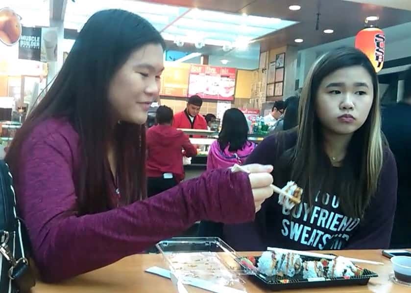 Two_women_eating_sushi