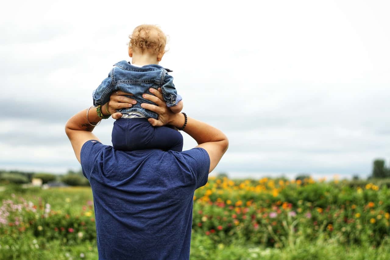 baby-sitting-on-man-s-shoulder-1497394