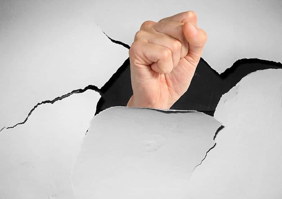 break-through-wall-fist-breakthrough-change