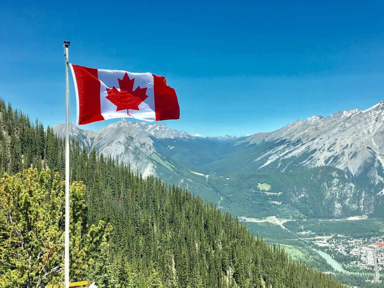 canada-flag-with-mountain-range-view-756790