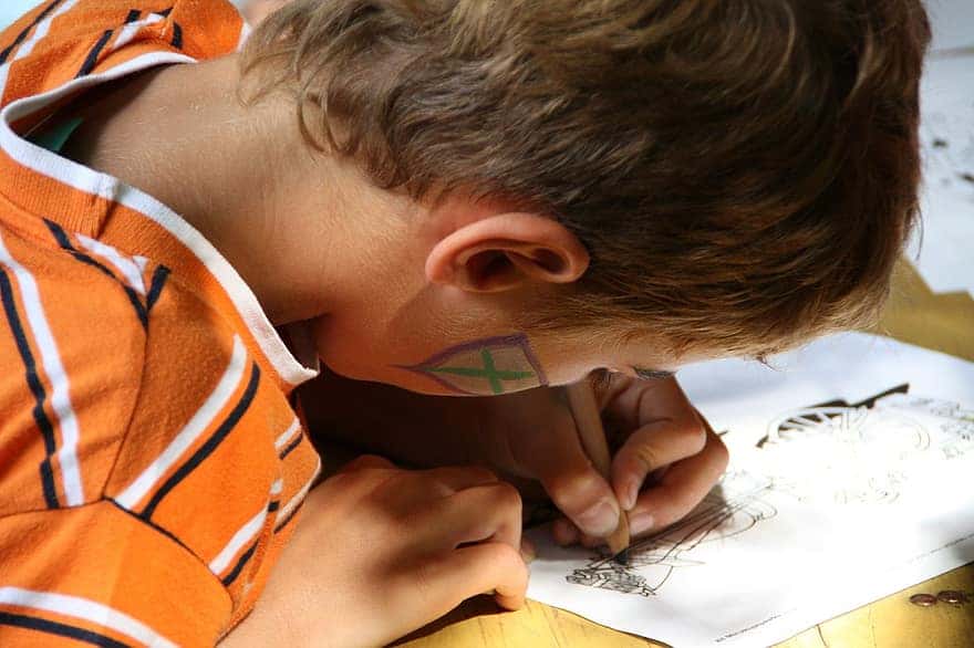 child-boy-paint-write-focused-draw