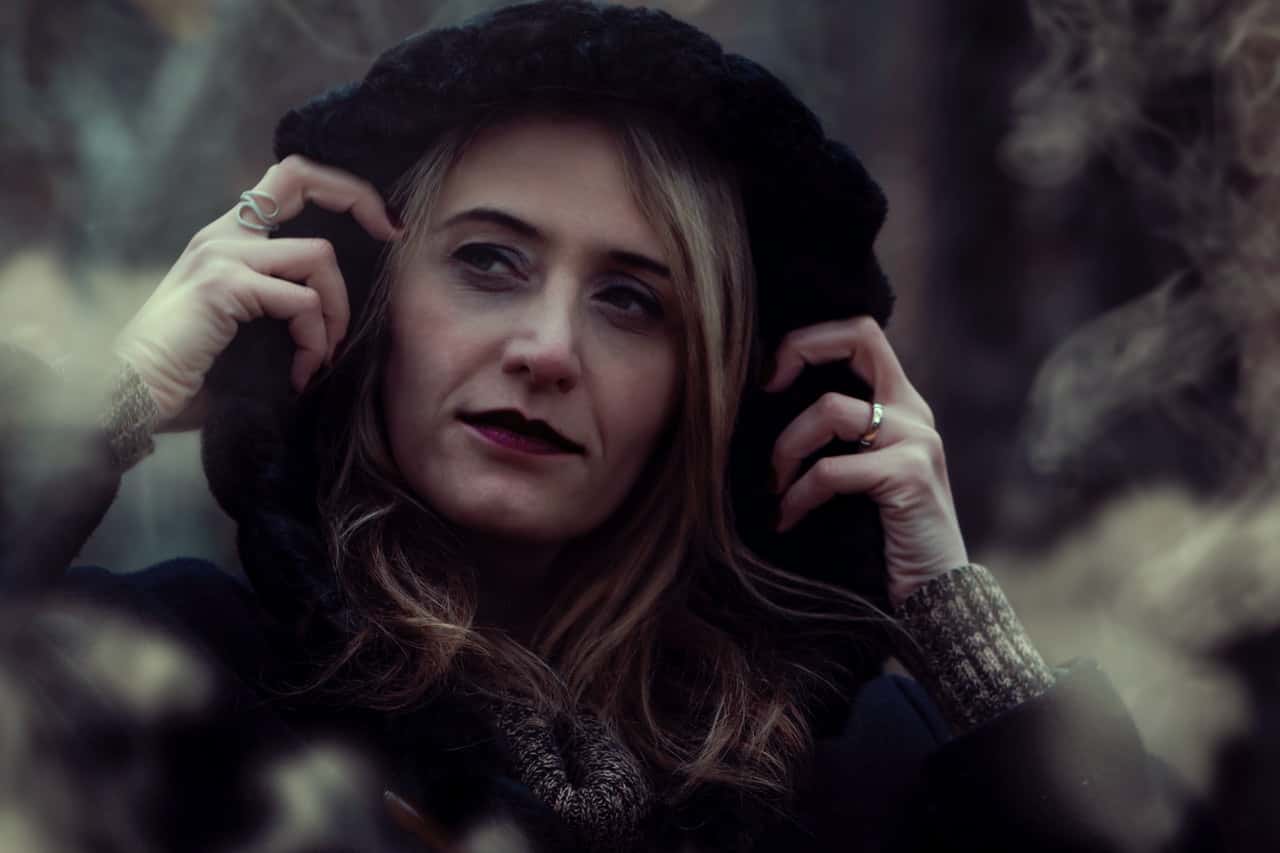 close-up-photography-of-woman-wearing-black-hooded-jacket-1548743