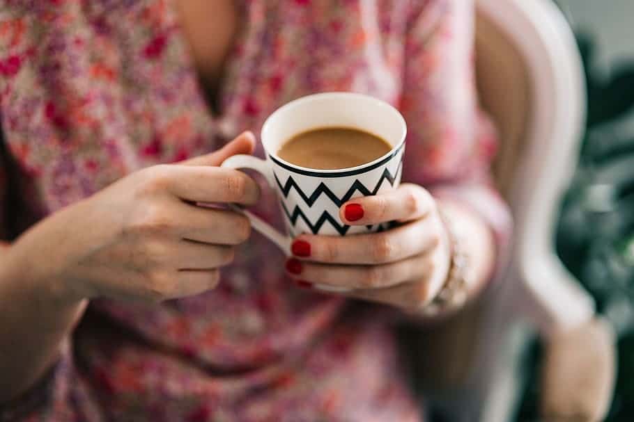 coffee-hands-nails-holding-red-mug