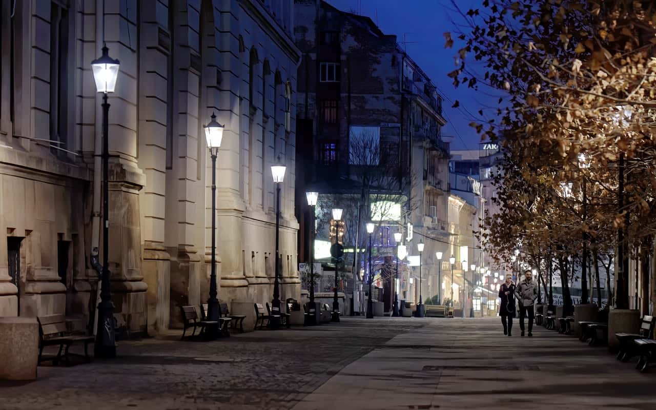 couple-walking-down-streeat-at-night-4143385