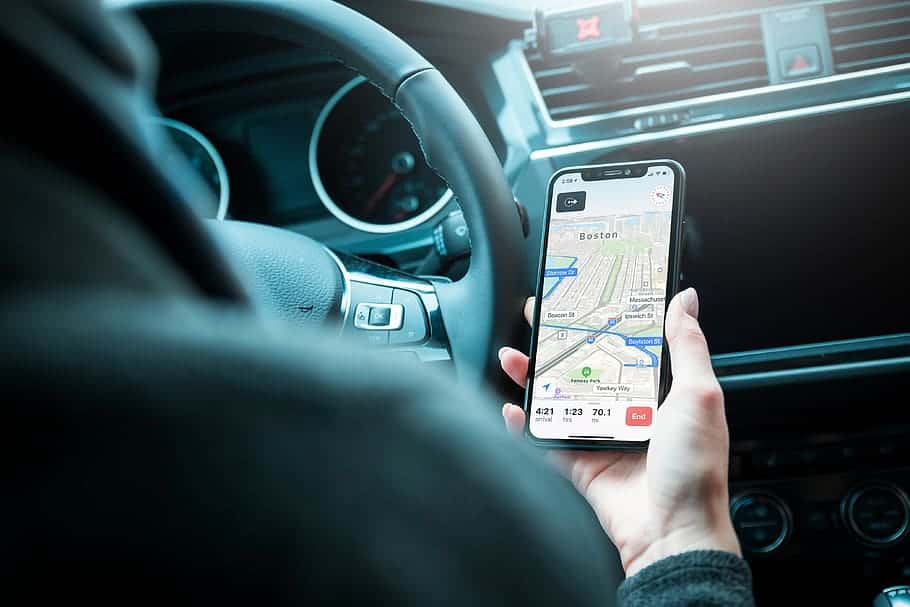 driver-using-modern-mobile-phone-map