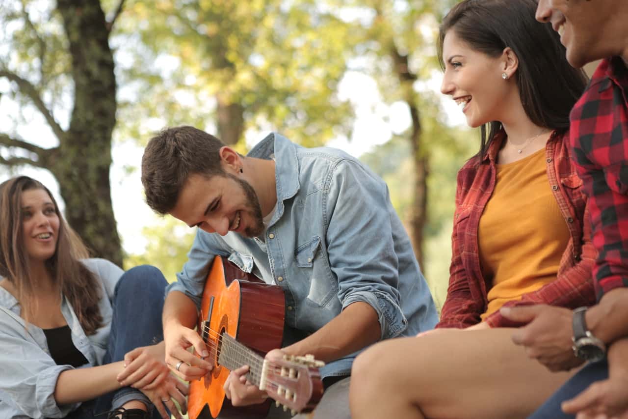 friends-spending-time-together-with-guitar-3777729