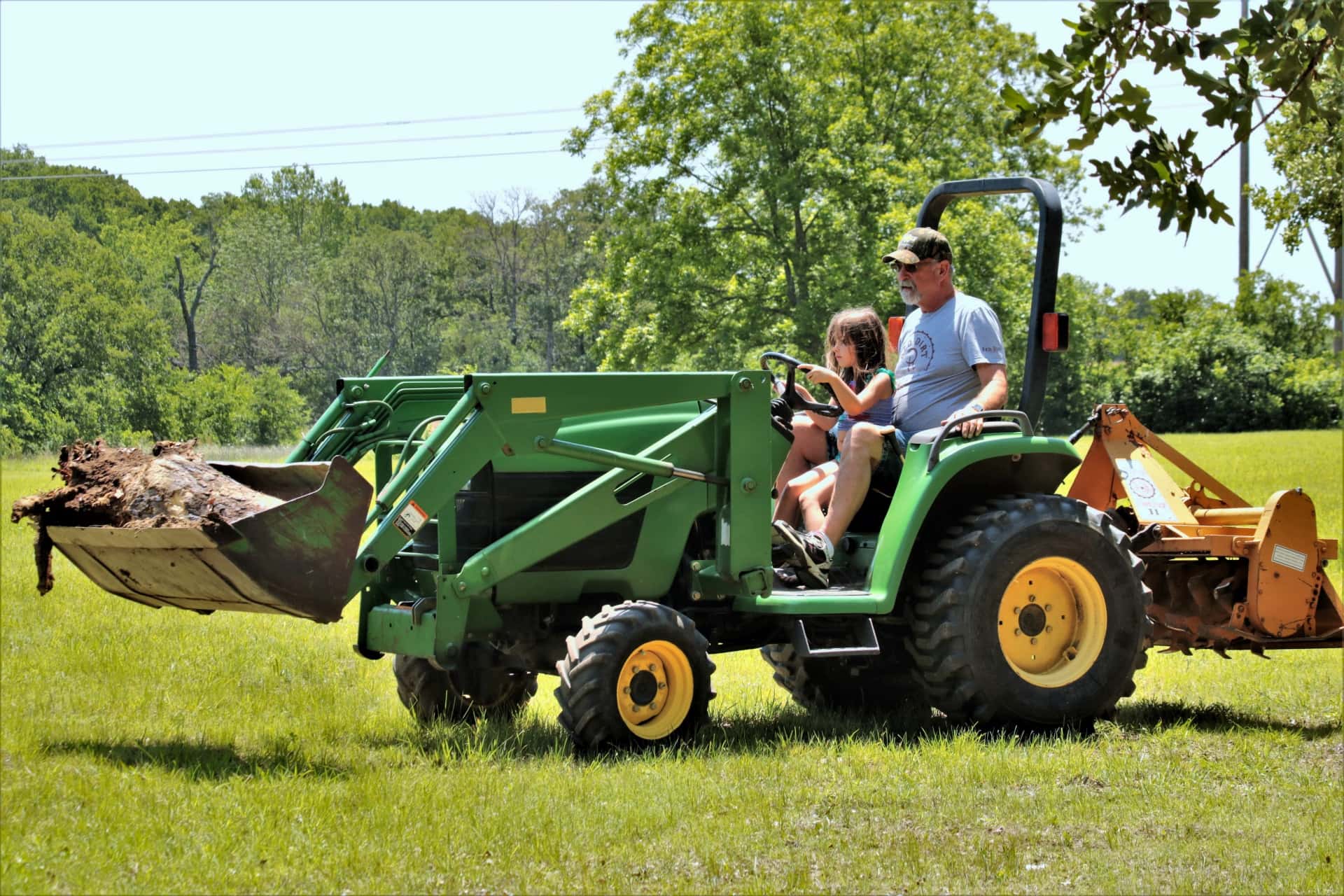 little-girl-driving-farm-tractor