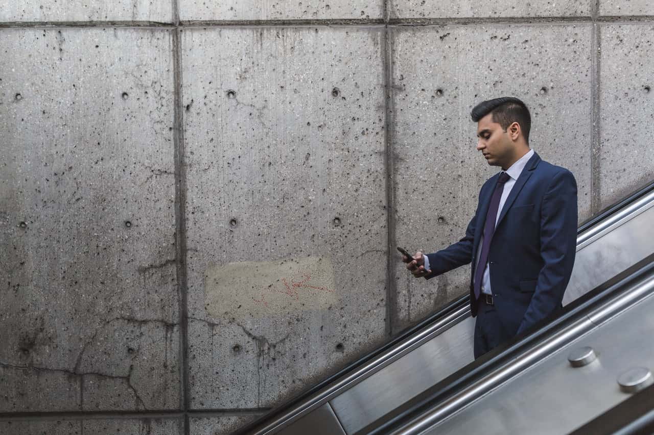 man-looking-at-his-phone-374139