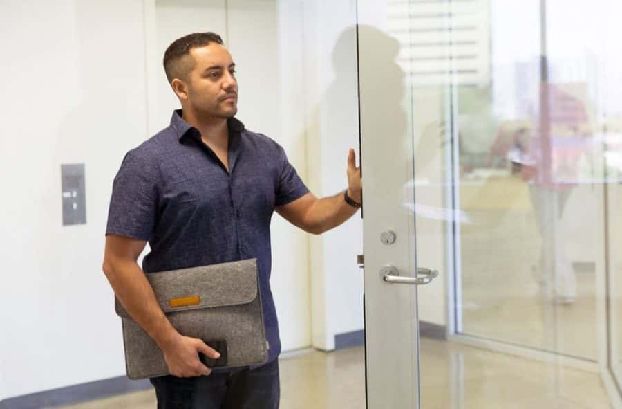 man-standing-next-to-glass-door-1251842 (1)