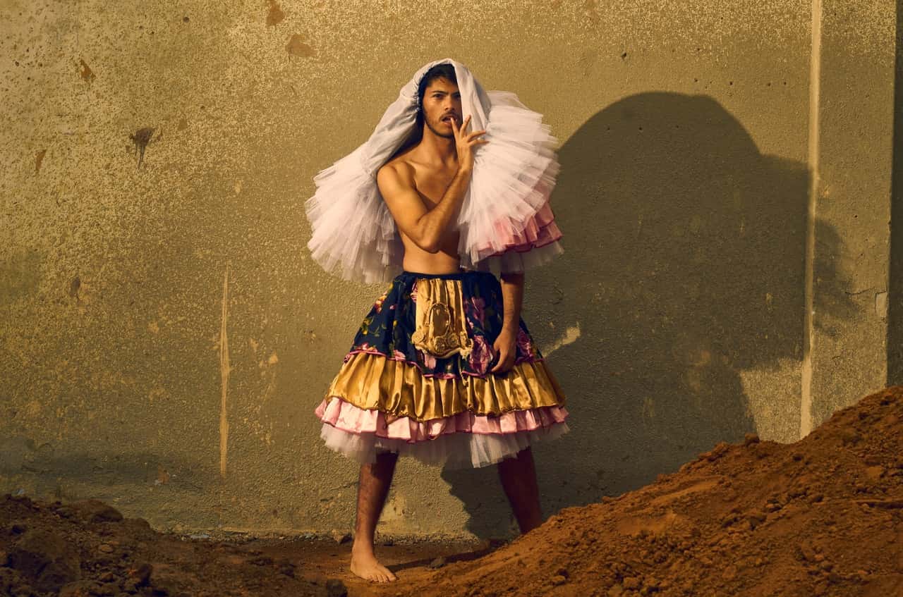 man-wearing-gold-and-pink-skirt-1325545