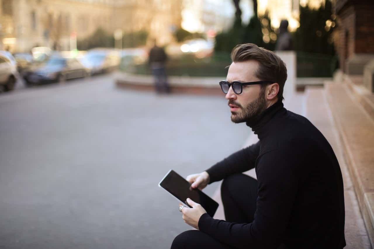 pensive-troubled-stylish-man-with-notepad-on-street-3776128