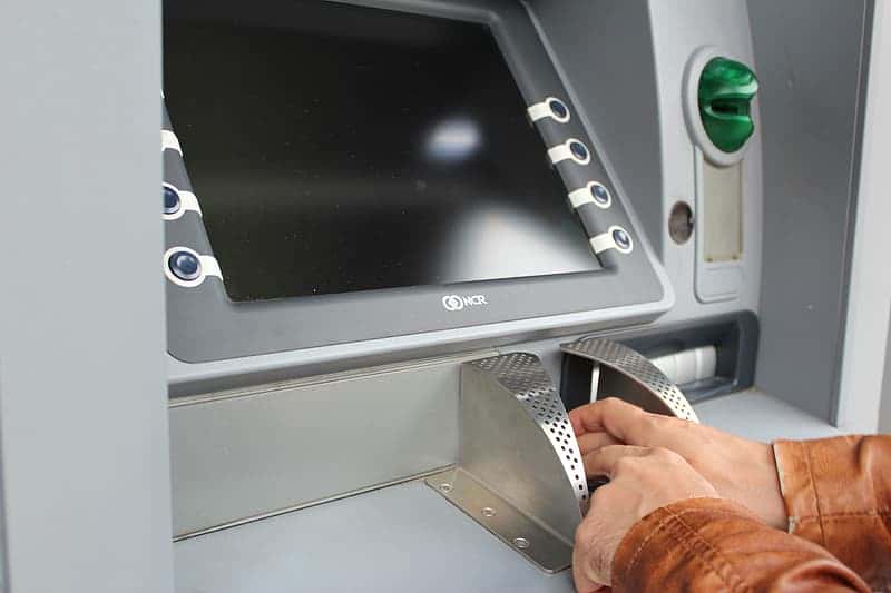 person-using-atm-machine