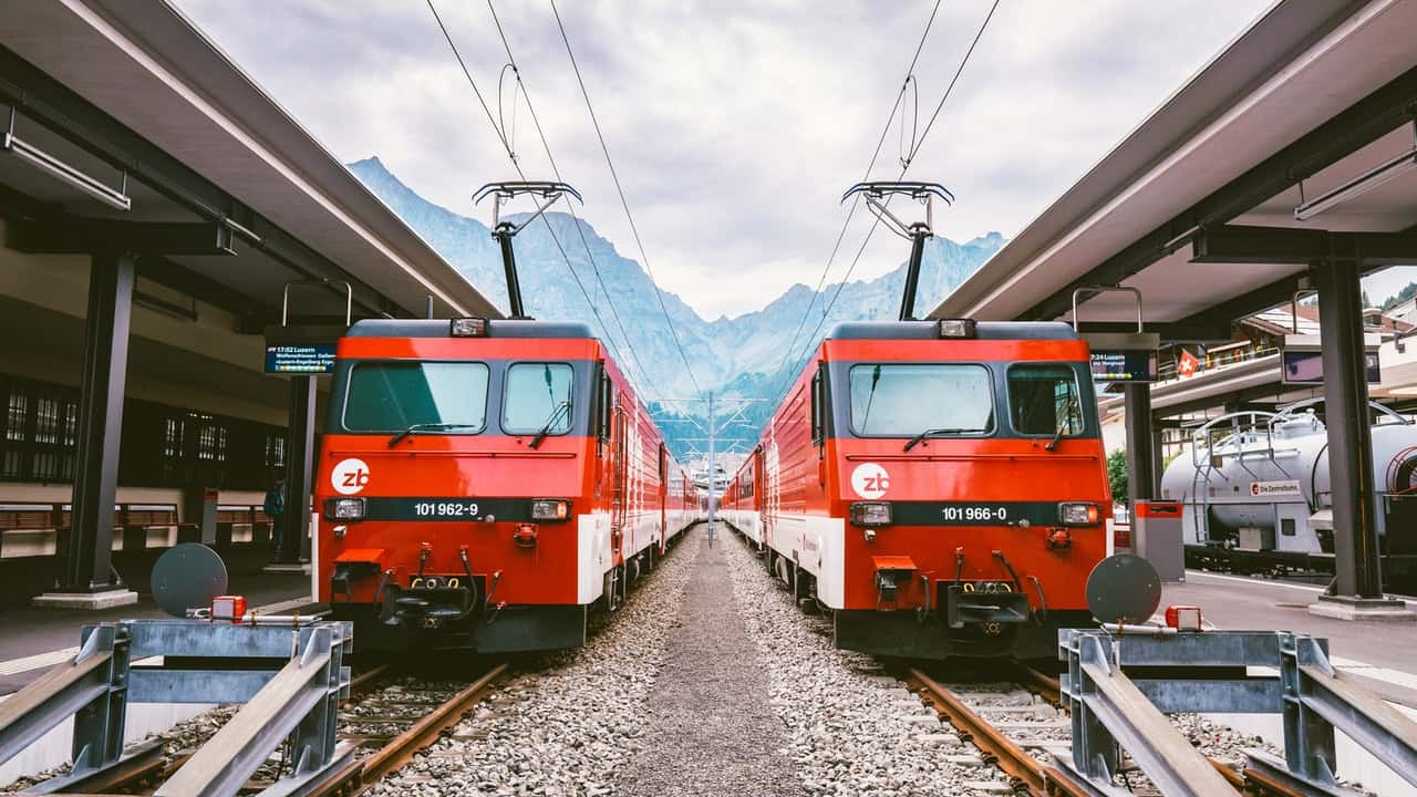 photo-of-two-red-trains-2031758