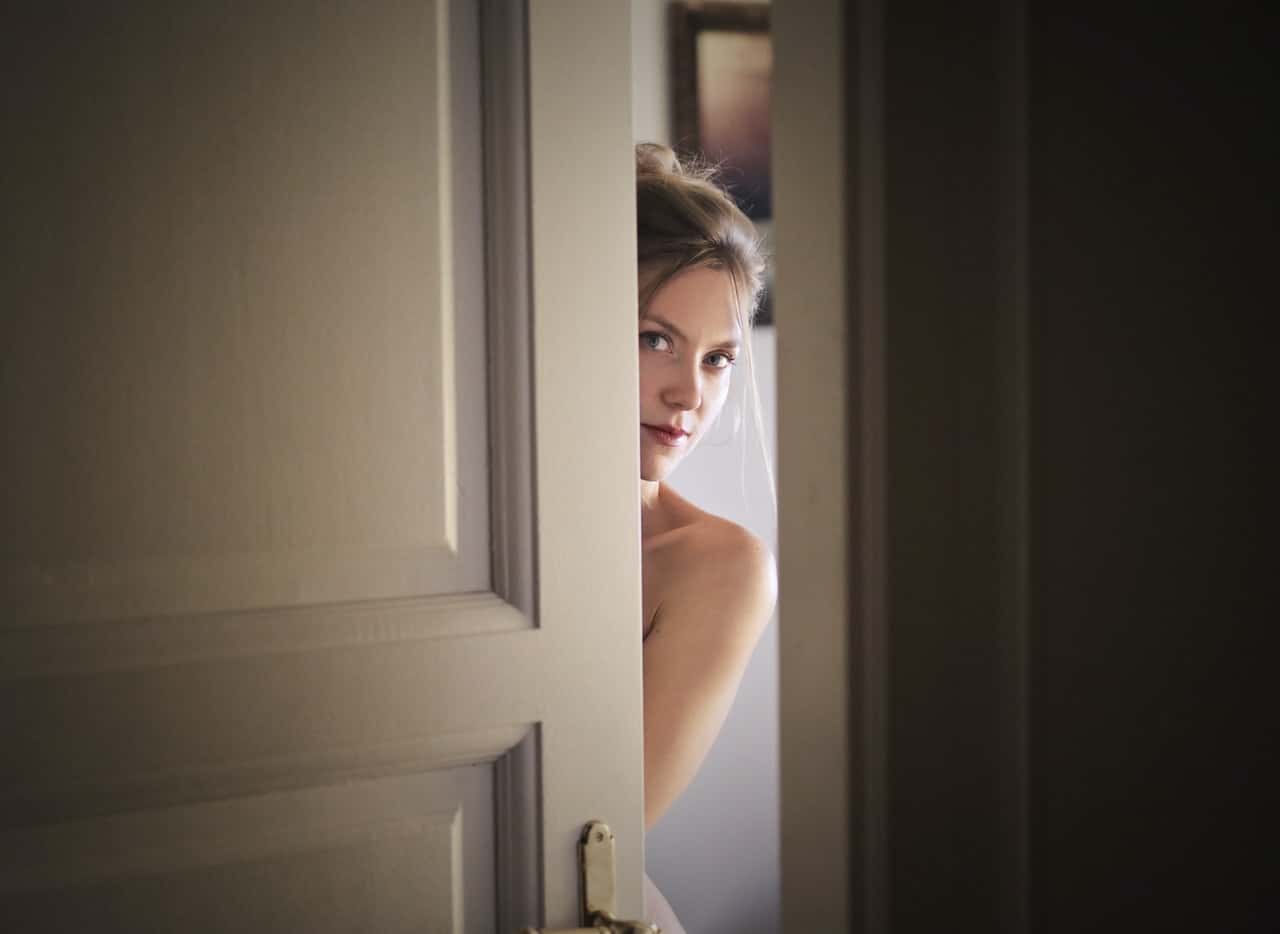 photo-of-woman-behind-door-1459558