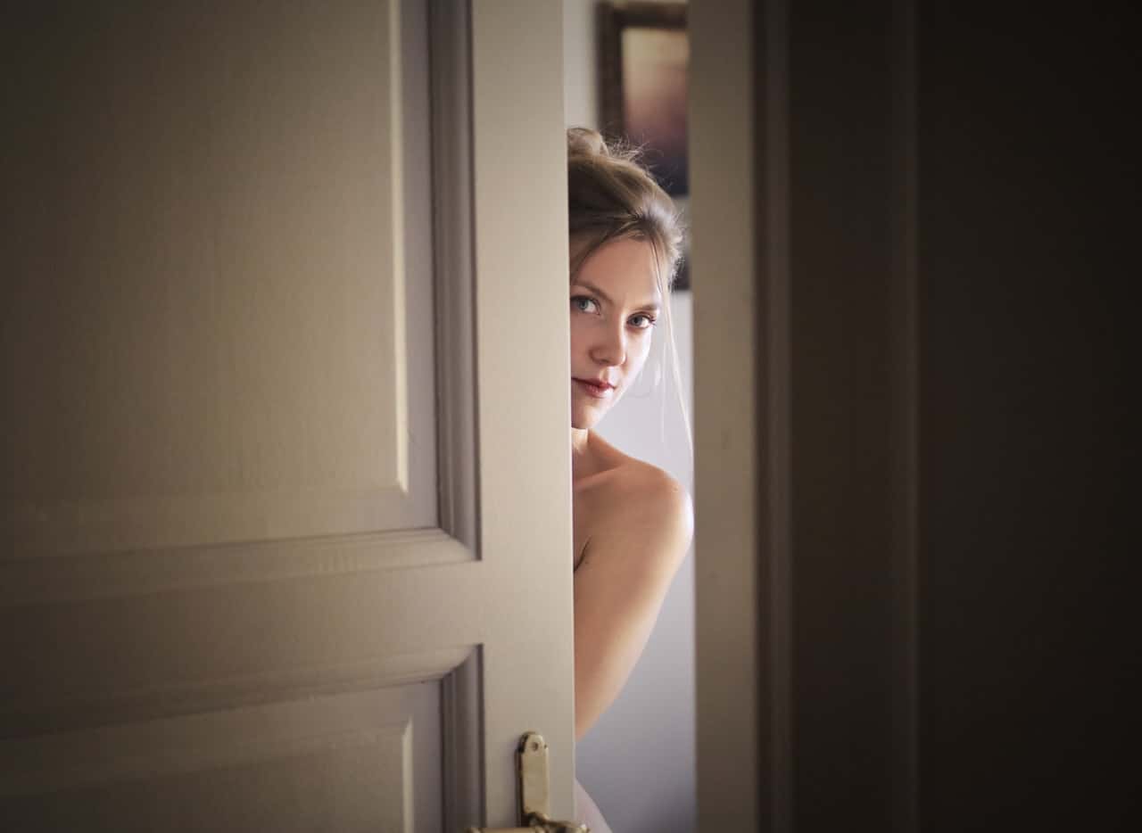 photo-of-woman-behind-door-1459558