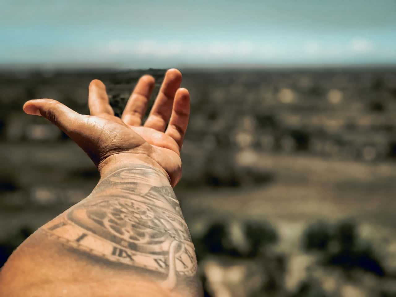 selective-focus-photography-of-person-s-arm-with-tattoo-2565085