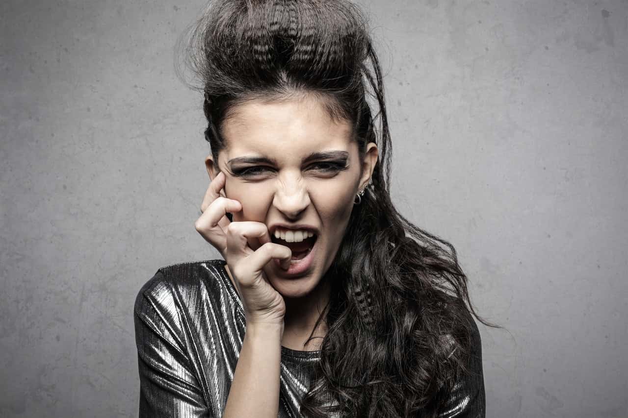 stylish-female-rocker-screaming-in-studio-3771103