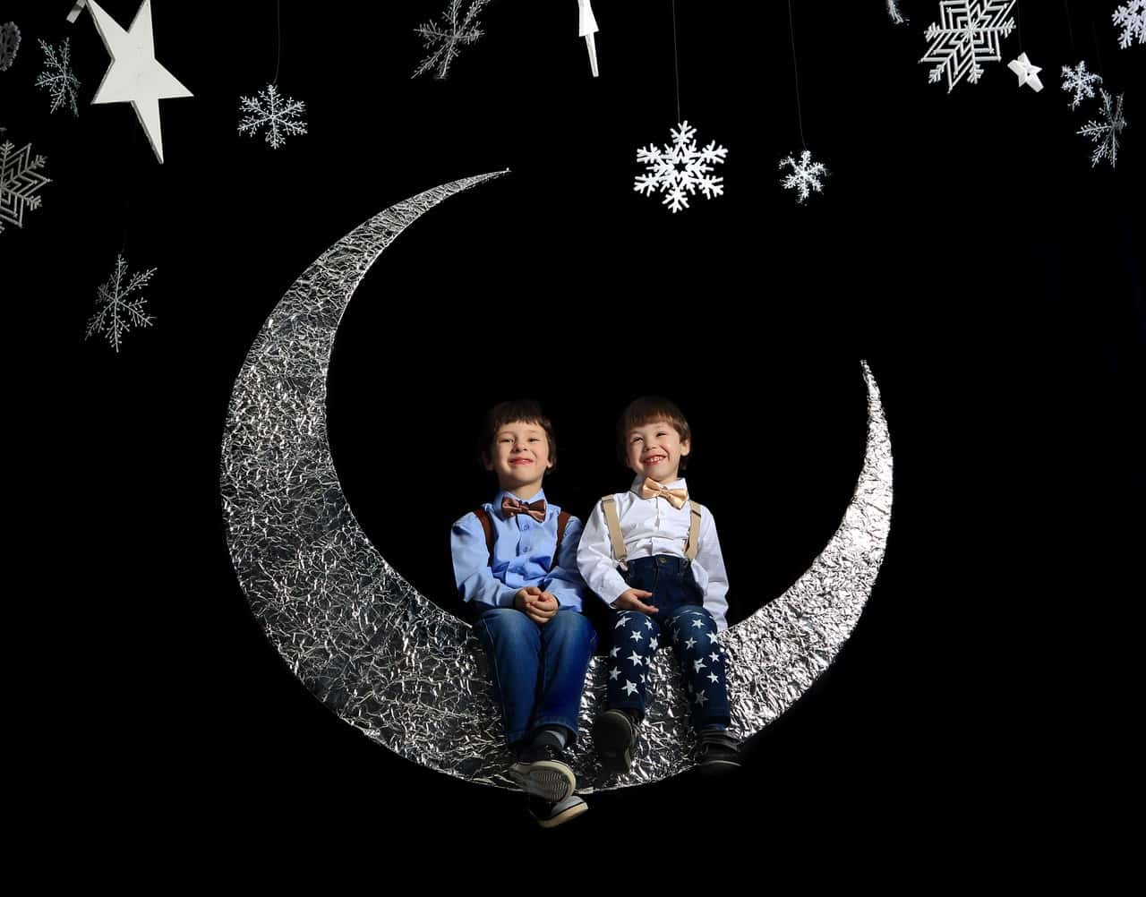 two-boys-sitting-on-crescent-moon-1651483