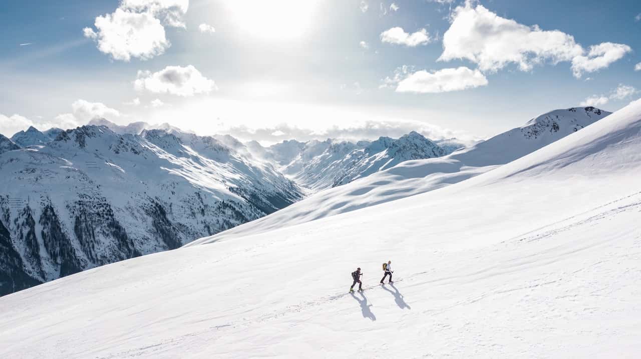 two-man-hiking-on-snow-mountain-869258