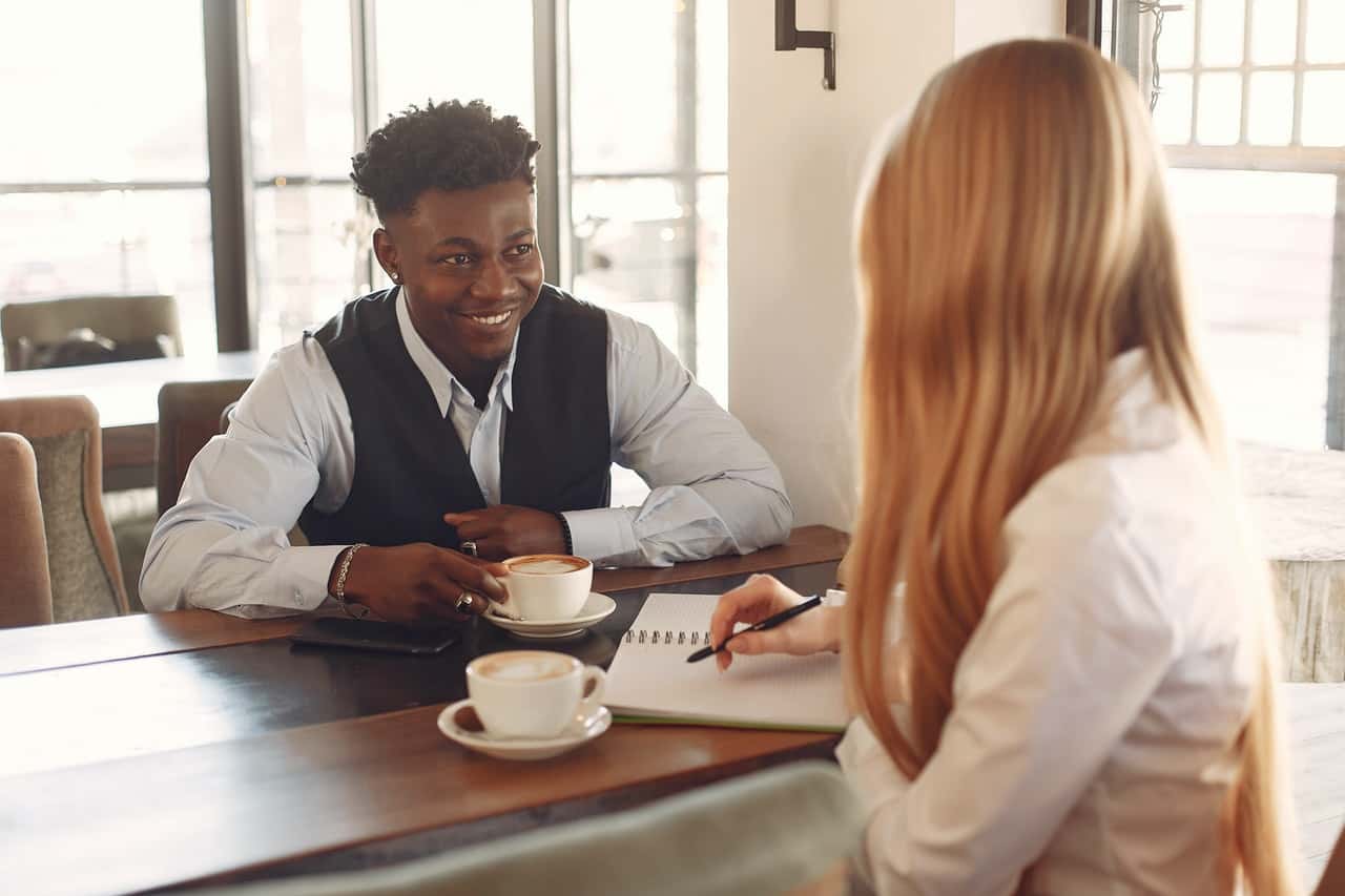 two-people-having-coffee-while-talking-3874031
