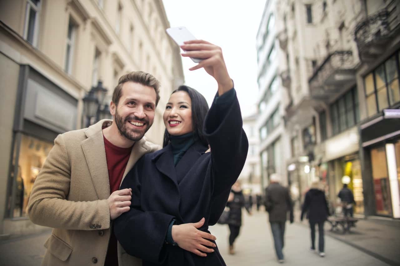 woman-in-black-coat-taking-photos-3775551