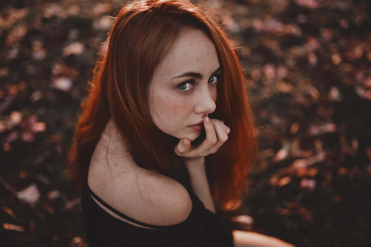 woman-touching-lips-2246452