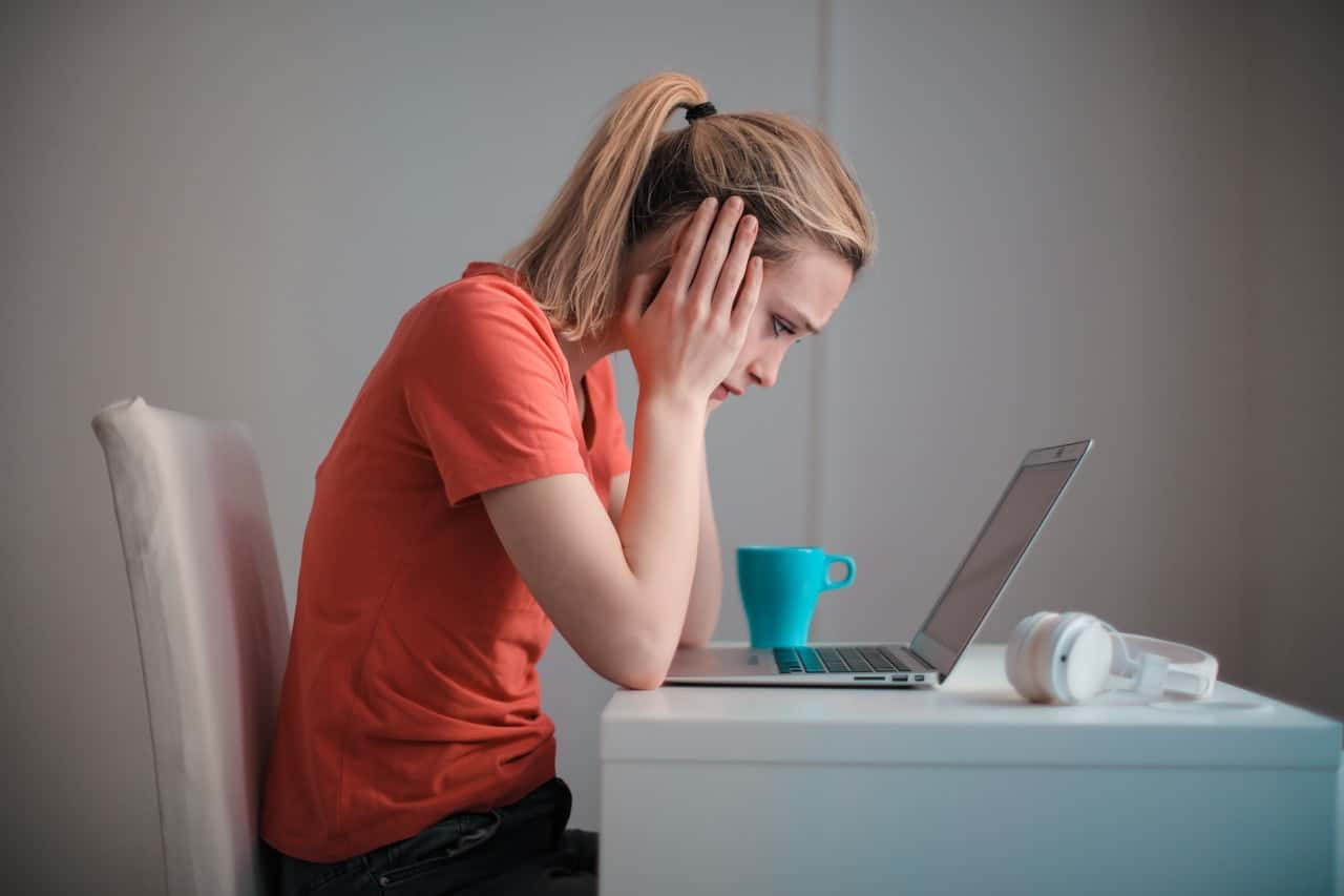 young-troubled-woman-using-laptop-at-home-3755755