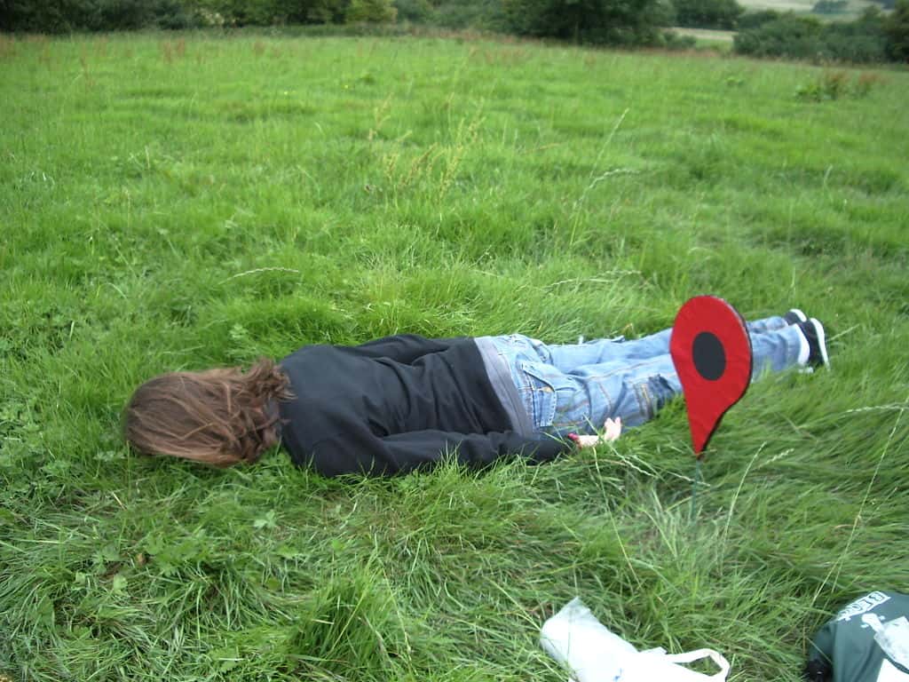 1024px-Playing_The_Lying_Down_Game_at_the_geohash