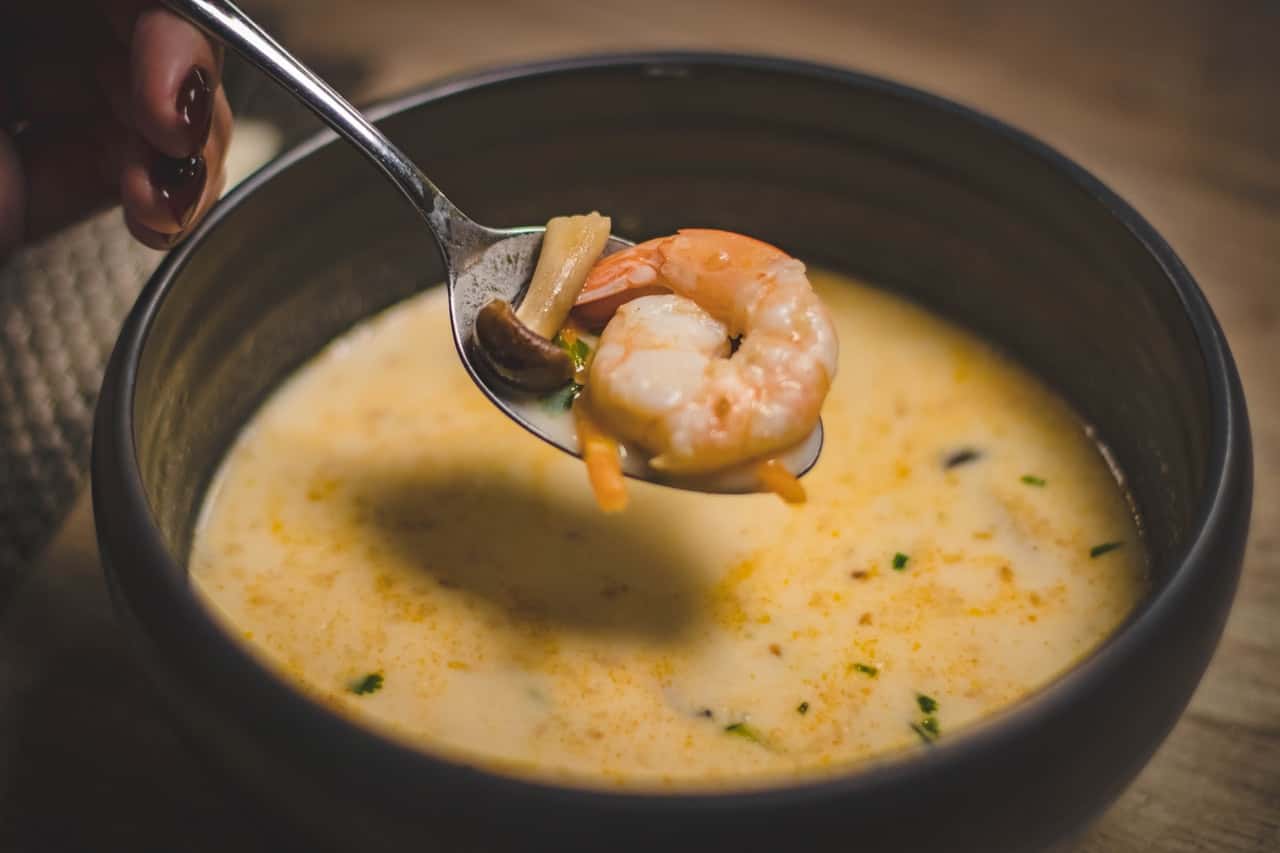 bowl-of-shrimp-soup-on-brown-wooden-surface-688802