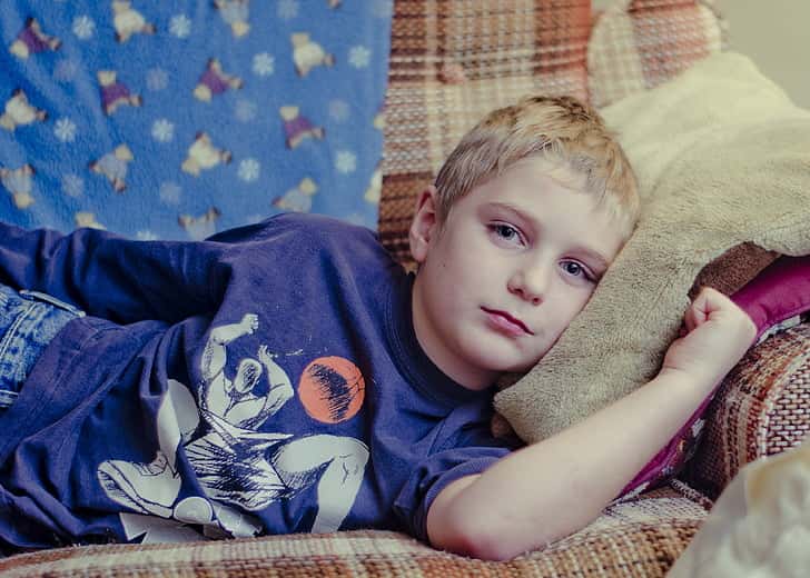 boy-cranky-sad-laying-down-preview
